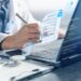 octor managing secure medical documentation and patient records on laptop.